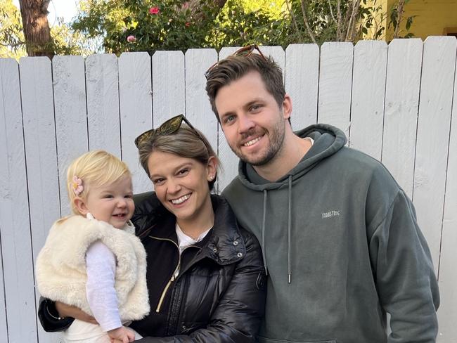 Mitch Keough and partner Amelia Perry with child Charlotte, 15 months.