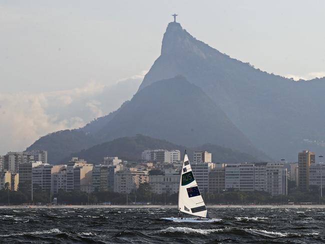 Australia’s Ashley Stoddart on the water as a change comes through and postponed the Laser Radial Women Medal Race at the Rio 2016 Olympic Games. Picture: Brett Costello