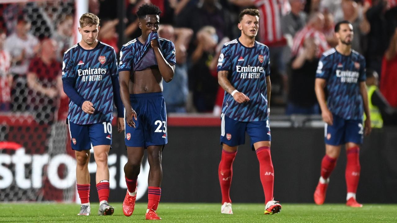 BRENTFORD, ENGLAND - AUGUST 13: Emile Smith Rowe and Albert Sambi Lokonga of Arsenal look dejected after conceding their second goal during the Premier League match between Brentford and Arsenal at Brentford Community Stadium on August 13, 2021 in Brentford, England. (Photo by Shaun Botterill/Getty Images)