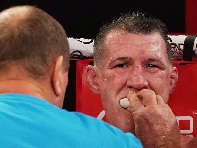 Paul Gallen is attended to during his fight against Barry Hall.