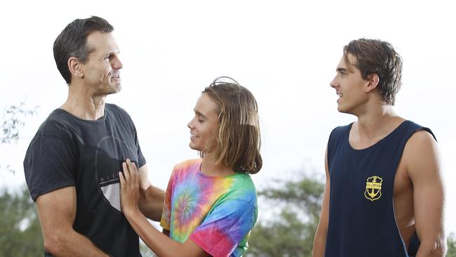 Paul Harragon with his sons Luke (black singlet) and Daniel Harragon. Picture: Dylan Robinson.