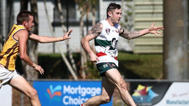 Hawks' Harrison Brown can't catch Cutters' James Dixon in the AFL Cairns match between the South Cairns Cutters and the Manunda Hawks, held at Fretwell Park, Bentley Park. PICTURE: BRENDAN RADKE