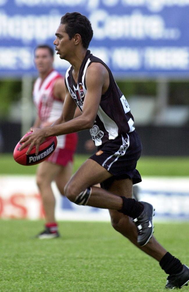 Palmerston’s Dion Grant prepares to kick the ball upfield.