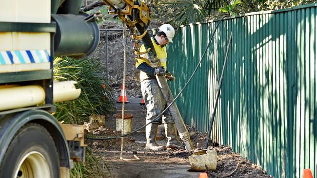 Sydney Water worker on scene of burst water main at the end of Brentford Road at Wahroonga on Monday. Picture: AAP