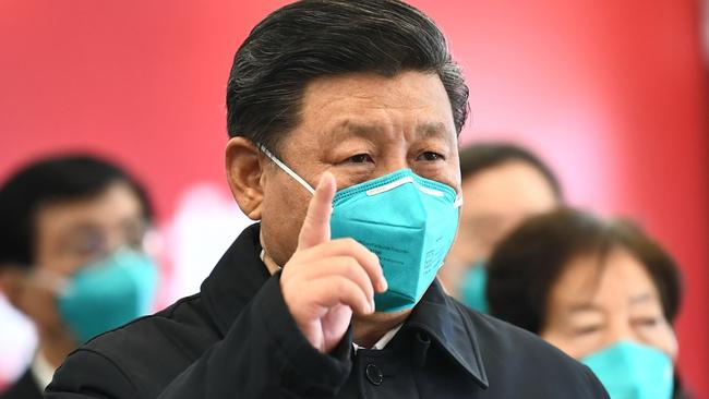 This photo released on March 10, 2020 by China's Xinhua News Agency shows Chinese President Xi Jinping wearing a mask as he GESTURES to a coronavirus patient and medical staff via a video link at the Huoshenshan hospital in Wuhan, in China's central Hubei province on March 10, 2020. (Photo by Xie Huanchi / XINHUA / AFP) / China OUT - Hong Kong OUT - Japan OUT - Germany OUT - United States OUT - United Kingdom OUT / -----EDITORS NOTE---- RESTRICTED TO EDITORIAL USE - ONE TIME USE - MANDATORY CREDIT "AFP PHOTO/XINHUA / XIE HUANCHI" - NO MARKETING NO ADVERTISING CAMPAIGNS - DISTRIBUTED AS A SERVICE TO CLIENTS - NO ARCHIVES /