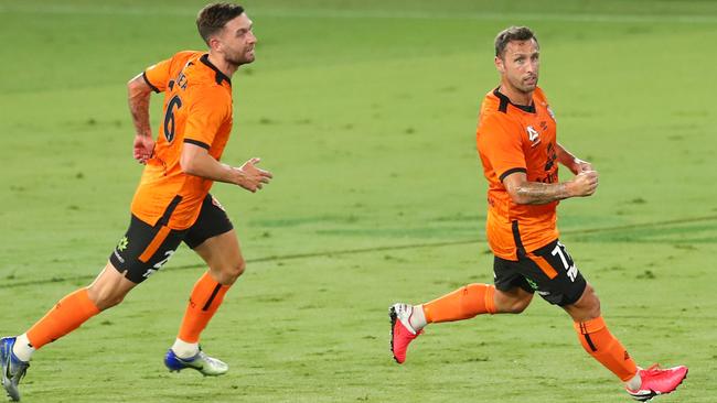 Scott McDonald, right, celebrates the matchwinner for the Roar. Picture: Getty Images