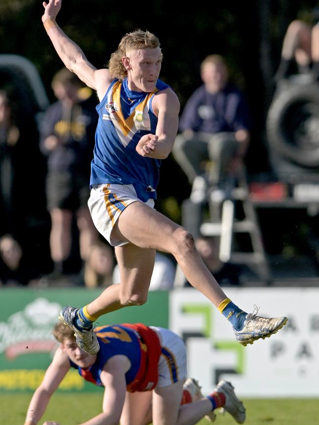 EFNL: Heathmont’s Harry Isaacs kicks long. Picture: Andy Brownbill