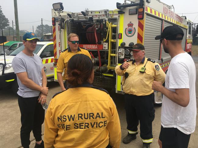 Paine and Lyon talk to RFS crew from Berrima. Picture: RFS