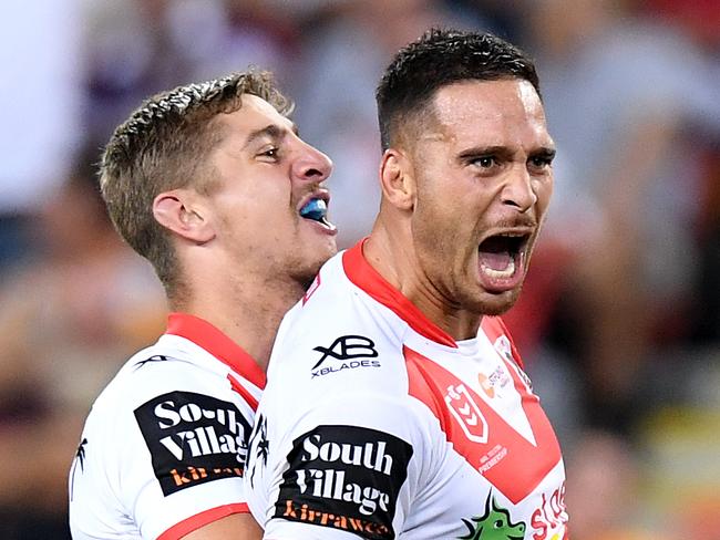 BRISBANE, AUSTRALIA - MARCH 28: Corey Norman of the Dragons is congratulated by team mates after kicking the winning field goal during the round 3 NRL match between the Brisbane Broncos and the St George Illawarra Dragons at Suncorp Stadium at Suncorp Stadium on March 28, 2019 in Brisbane, Australia. (Photo by Bradley Kanaris/Getty Images)