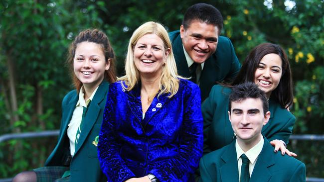 Claire Georgey (left) with schoolmates at Merrylands High School and President of NSW Secondary Principals’ Council Lila Mulaarcyzk in 2014. Picture: Adam Taylor