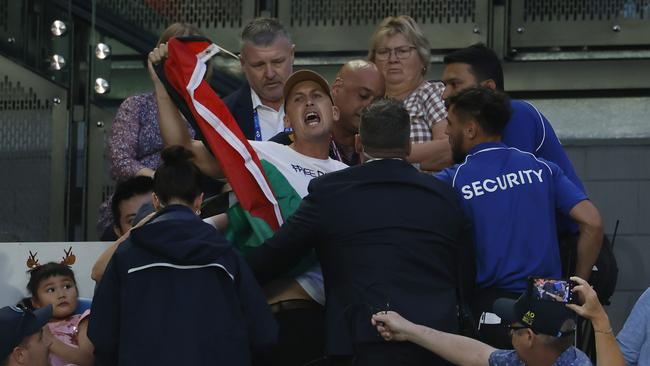 The protester was quickly handled by security. Photo: Michael Klein