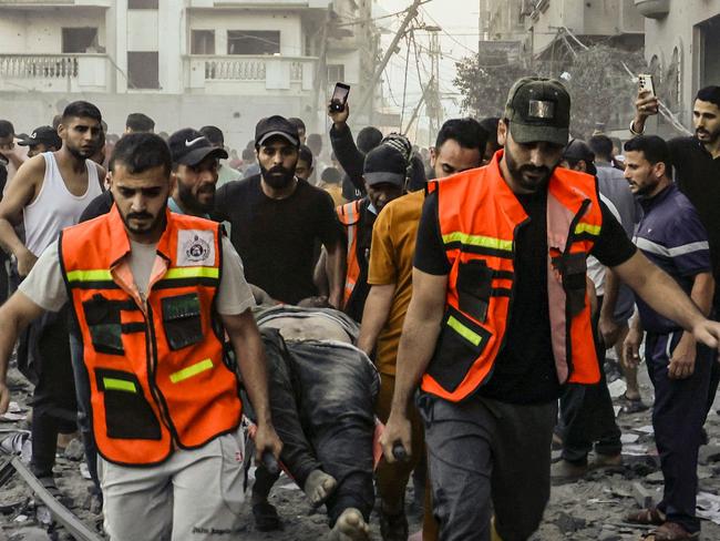 Rescuers remove the body of a man killed in an Israeli strike on Rafah in the southern Gaza Strip. Picture: AFP