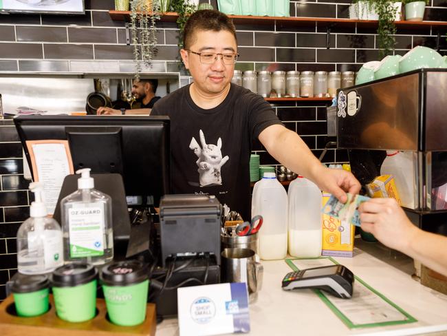 Scott Sang was forced to go back to cash transactions at his cafe Badmanner Thymes in Parramatta, which he says had lost 30 per cent of its regular daily income by lunchtime. Picture: Max Mason-Hubers