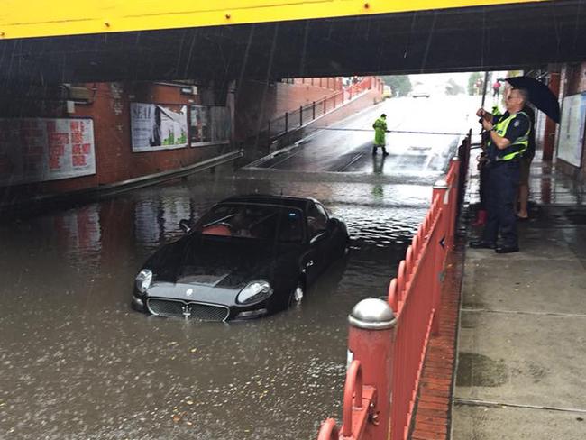 A Maserati that was flooded after the driver attempted to navigate a flooded underpass at Victoria Street in Seddon, Melbourne on Saturday. Picture: AAP Image/Supplied/Sarah Schubert