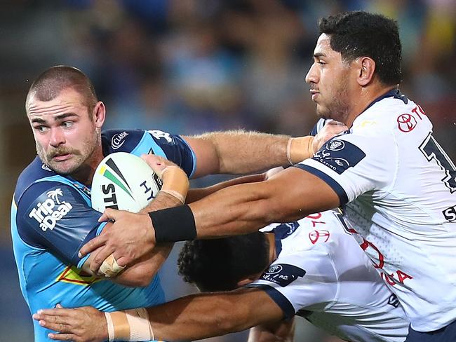 GOLD COAST, AUSTRALIA - SEPTEMBER 01:  Keegan Hipgrave of the Titans is tackled during the round 25 NRL match between the Gold Coast Titans and the North Queensland Cowboys at Cbus Super Stadium on September 1, 2018 in Gold Coast, Australia.  (Photo by Chris Hyde/Getty Images)