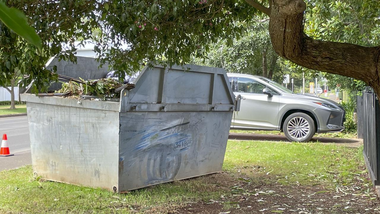 Scene of car crash in Mackenzie St in East Toowoomba. After hitting a tree the Ford sedan then hit a skip. Saturday, March 25, 2023. Picture: Nev Madsen.