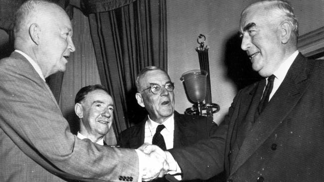 Dwight Eisenhower greets Robert Menzies at the White House in 1956, as Sir Percy Spender, second from left, and John Foster Dulles look on. Picture: Press United