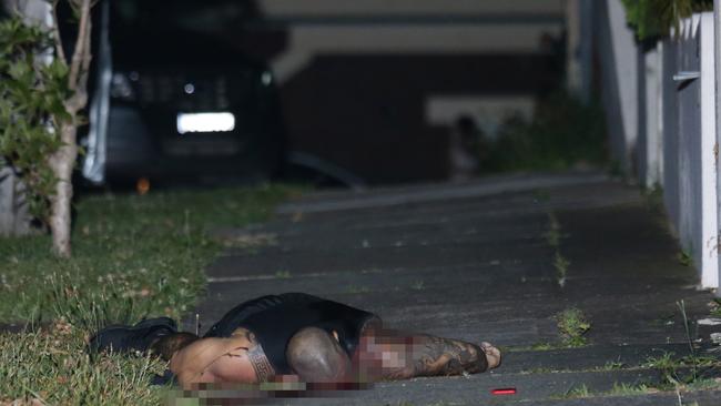 The bloody body of Pasquale Barbaro lies in a Earlwood driveway after he was assassinated. Picture: Bill Hearne