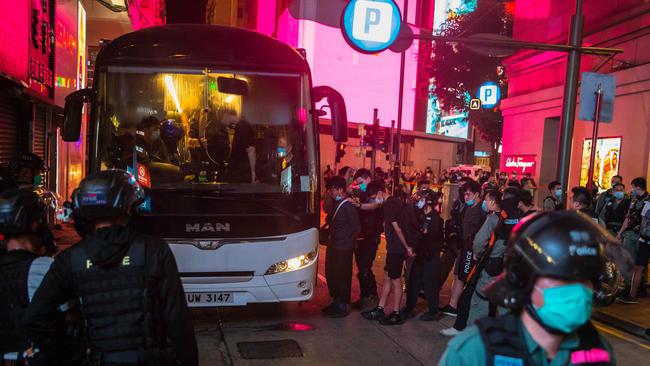 Police detain people on a bus after they cleared protesters taking part in a rally against a new national security law in Hong Kong on July 1, 2020. Picture: AFP