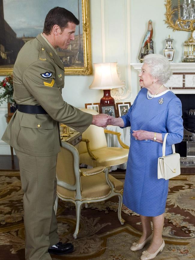 Mr Roberts-Smith with Queen Elizabeth at Buckingham Palace in London. Picture: Anthony Devlin