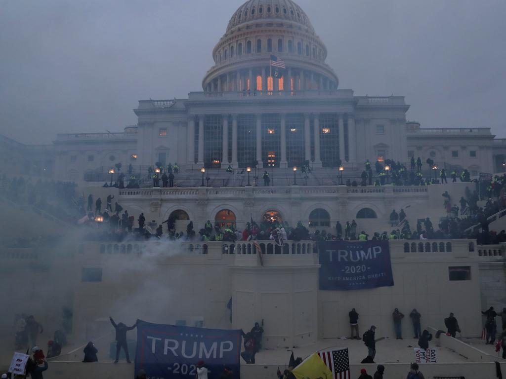 Police officers stand guard as supporters of US President Donald Trump launch an attack on the Capitol on January 6. Picture: REUTERS/Leah Millis