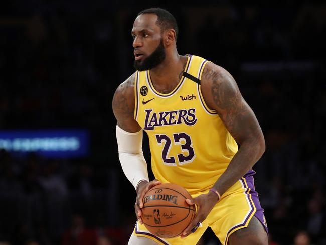 (FILES) In this file photo taken on March 5, 2020 LeBron James #23 of the Los Angeles Lakers handles the ball in a game against the Philadelphia 76ers during the second half at Staples Center on March 3, 2020 in Los Angeles, California. - LeBron James said April 8, 2020, the abrupt shutdown of the NBA season due to the worldwide coronavirus pandemic has left the Los Angeles Lakers feeling like they still have something to prove.  The Lakers were in the midst of a revival season, having made the playoffs for the first time in seven years, when the league suspended the 2019-20 season on March 11 after Rudy Gobert tested positive for COVID-19. (Photo by Kateyln MULCAHY / GETTY IMAGES NORTH AMERICA / AFP)