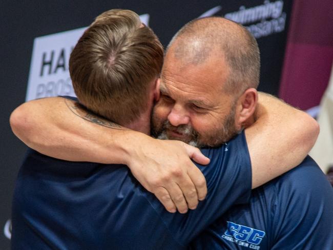 Richard Sleight and Liam Smith hug on the final night of the 2024 state swimming championships, December 20, on the Gold Coast. Picture Supplied