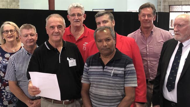 Seven of the eight mayoral candidates at the ballot draw with Returning Officer Ray Langler. PHOTO: JUDITH KERR