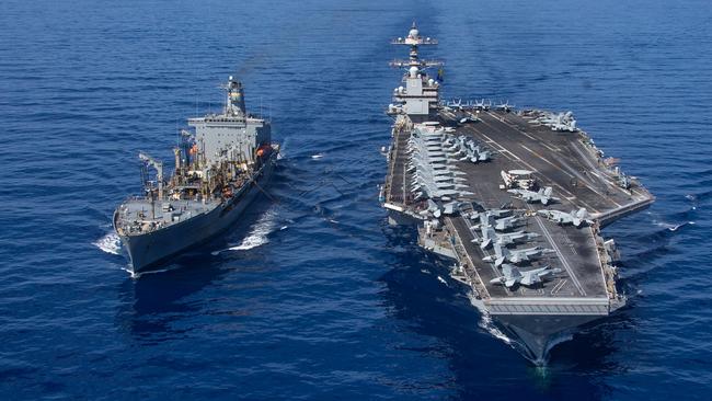 The world's largest aircraft carrier USS Gerald R. Ford is fuelled at sea by the oiler USNS Laramie in the eastern Mediterranean last week. Picture: US Navy via AFP