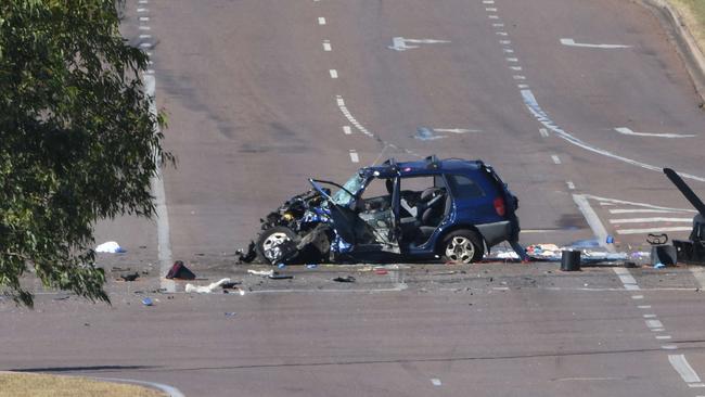 The car was left a mangled wreck after the crash at the intersection of Tiger Brennan Drive and Berrimah Rd. Picture: Katrina Bridgeford