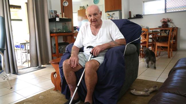 Kamerunga Villas resident Michael Brooks to keep cool in 35C heat has spent days since flooding cut power his unit in the bathtub filled with cold water. Picture: Peter Carruthers