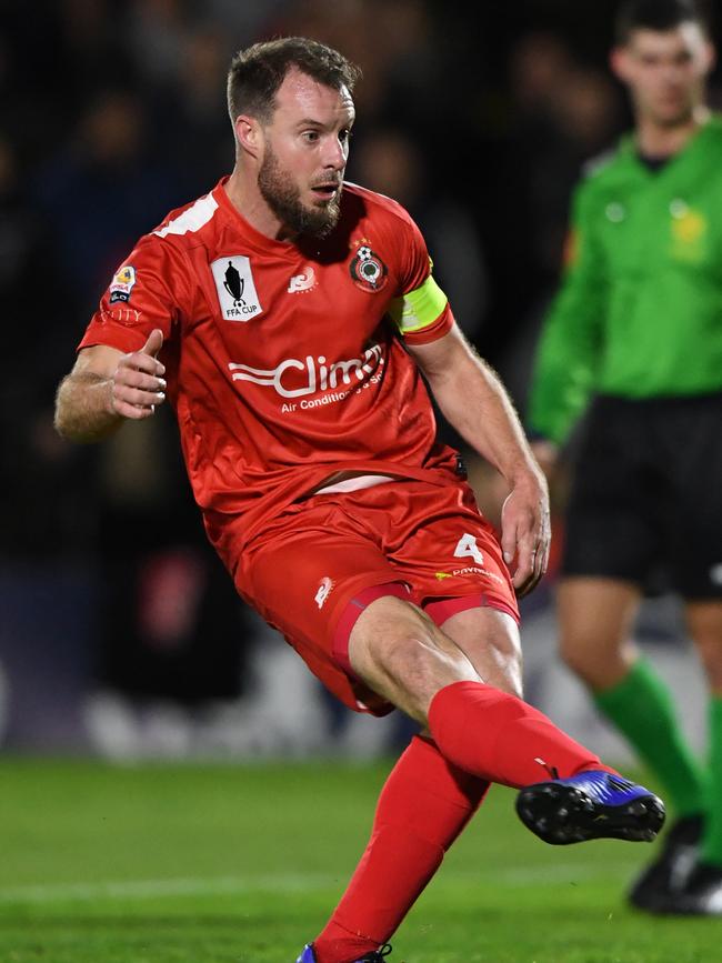 Campbelltown captain Iain Fyfe converts a penalty against Melbourne City in the FFA Cup round of 32 3-1 loss this year at Newton.