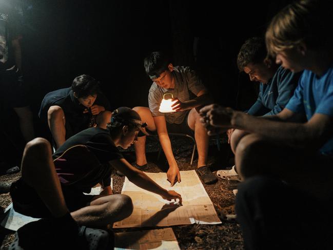 Hutchins school students tackling a challenge in Port Davey, Tasmania.