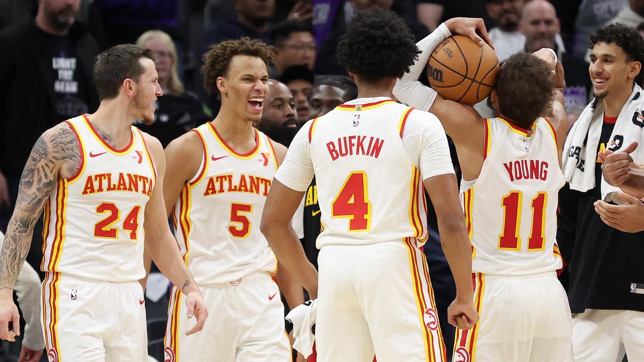 Australian Dyson Daniels, #5 of NBA’s Atlanta Hawks, is congratulated by teammates after he stripped the ball from De’Aaron Fox of the Sacramento Kings at the end of the game on November 18 in Sacramento, California. Picture: Ezra Shaw/Getty Images/AFP