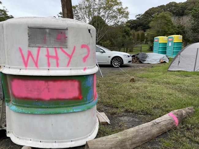 The top half of a portaloo with the word “Why” sprayed across it was one of the first things to appear as part of the protest. Picture: NewsLocal