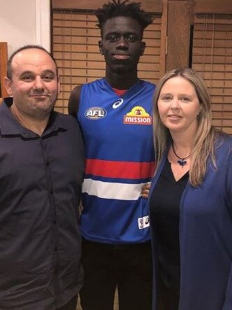 Western Bulldogs defender Buku Khamis with his 'second family' Charles Grech and Kellie Ryan. Picture: Instagram