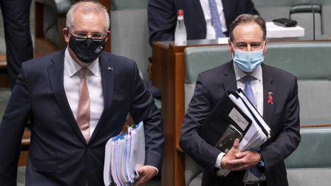 Health Minister Greg Hunt, right, will use the last parliamentary sitting day of the year to announce his retirement, sources say. Picture: Martin Ollman
