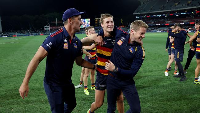 Rory Sloane celebrates with Jordan Dawson after his match-winning goal. He faces a test to return in round 4. Picture: James Elsby/AFL Photos via Getty Images