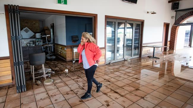 Co-owner Rina Maruzza was overwhelmed as she returned to survey the damage. Picture Julian Andrews