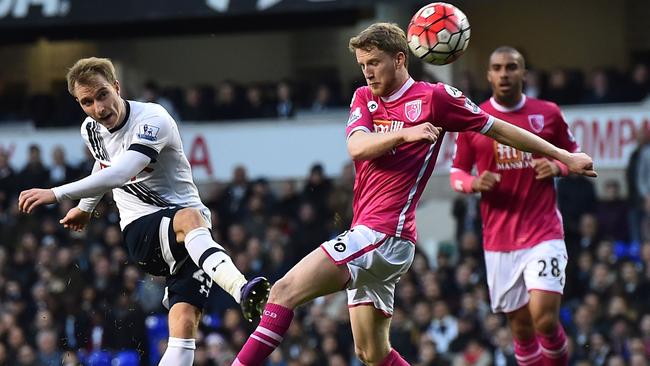 Tottenham Hotspur's Christian Eriksen (L) shoots.