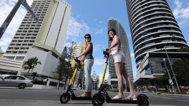 Hannah Roscoe and Maddie Ryan both do the right thing by wearing helmets during a cruise through Broadbeach. Photo: Glenn Hampson