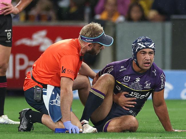 MELBOURNE, AUSTRALIA - MARCH 20:  Jahrome Hughes of the Storm and Nathan Cleary of the Panthers are attended to by trainers after a collision during the round three NRL match between the Melbourne Storm and Penrith Panthers at AAMI Park on March 20, 2025, in Melbourne, Australia. (Photo by Daniel Pockett/Getty Images)