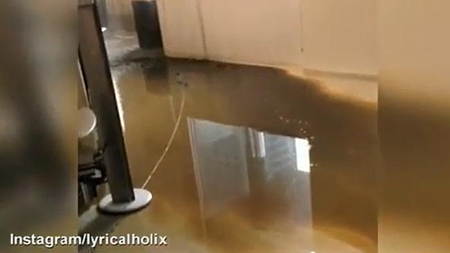 The brown water that leaked from burst pipes.