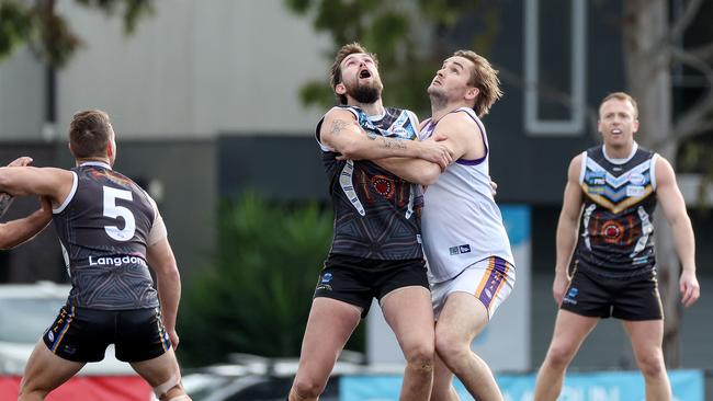 Liam Read of Caroline Springs battles with Matthew Trzeciak of Altona. Picture: George Salpigtidis