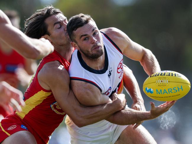 ADELAIDE, AUSTRALIA - MARCH 06: Brad Crouch of the Crows is tackled by Lachie Weller of the Suns during the 2020 Marsh Community Series match between the Adelaide Crows and the Gold Coast Suns at Flinders University Stadium on March 06, 2020 in Adelaide, Australia. (Photo by AFL Photos)