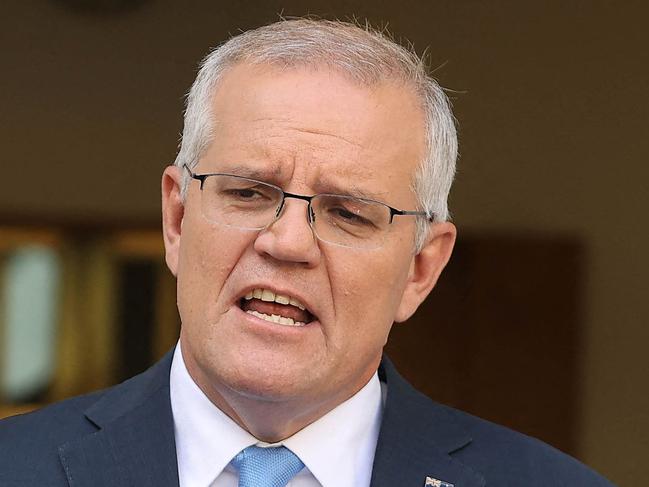 Australia's Prime Minister Scott Morrison attends a press conference at Parliament House in Canberra on April 10, 2022. - Australian Prime Minister Scott Morrison on April 10 called federal elections for May 21, launching a come-from-behind battle to stay in power after three years rocked by floods, bushfires and the Covid-19 pandemic. (Photo by AFP)