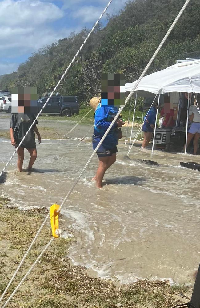 A Teewah Beach camper posting on social media under the name “Kath D Wino” was caught off guard by the high tides from ex tropical cyclone Seth, and had water come right into her campsite. Photo: Facebook