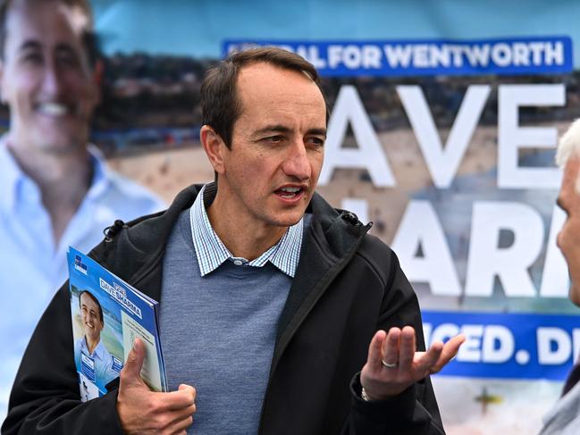 Liberal member for Wentworth Dave Sharma speaks to voters during Australia's general election at a polling station at Bondi Beach in Sydney. Picture: Steven Saphore