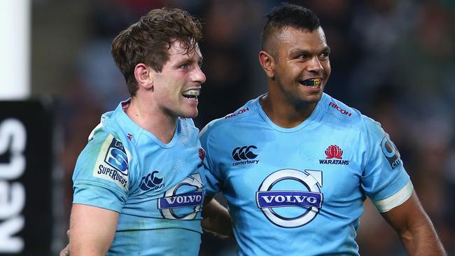 SYDNEY, AUSTRALIA - MAY 23: Bernard Foley (L) of the Waratahs celebrates with his team mate Kurtley Beale of the Waratahs after scoring a try during the round 15 Super Rugby match between the Waratahs and the Crusaders at ANZ Stadium on May 23, 2015 in Sydney, Australia. (Photo by Mark Kolbe/Getty Images)