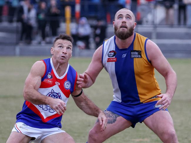 NFL footy: Macleod v North Heidelberg at De Winton Park, Rosanna, June 11th. Brent Harvey for North Heidelberg rucks against number 27 for Macleod.Picture : George Salpigtidis